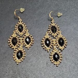 **Sale** Gold tone dangling earrings with black beads